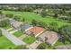 Desirable neighborhood situated on a golf course with mature trees and sidewalks at 487 Thistledown Way, The Villages, FL 32162