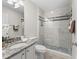 Updated bathroom features a glass shower door and granite countertop sink at 487 Thistledown Way, The Villages, FL 32162