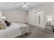 Bright bedroom with carpet, ensuite bathroom, and walk-in closet at 487 Thistledown Way, The Villages, FL 32162
