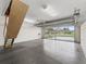 Clean epoxy floor garage with a glass door provides lots of light at 487 Thistledown Way, The Villages, FL 32162