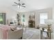 Bright living room with large windows and vaulted ceiling at 487 Thistledown Way, The Villages, FL 32162