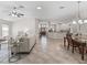 Open floor plan with living room, kitchen, and dining room at 487 Thistledown Way, The Villages, FL 32162