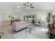 Open living space flows into dining room; patio doors to yard at 487 Thistledown Way, The Villages, FL 32162