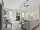 Sun-filled living room with neutral decor and stylish furnishings at 487 Thistledown Way, The Villages, FL 32162