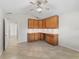 Bright office space features built-in cabinets and ceramic tile flooring at 487 Thistledown Way, The Villages, FL 32162