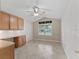 Office or bonus room features built-in cabinets and a large window at 487 Thistledown Way, The Villages, FL 32162