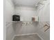 Well-organized walk-in closet featuring white wire shelving at 487 Thistledown Way, The Villages, FL 32162