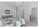 Bedroom featuring neutral decor, two closets, and ensuite bathroom at 4874 Noreen Ct, The Villages, FL 32163