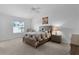 Bright bedroom with a ceiling fan, a window with blinds, and neutral decor at 4874 Noreen Ct, The Villages, FL 32163