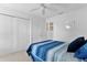 Neutral bedroom featuring a plush bed, large closet, and recessed lighting at 4874 Noreen Ct, The Villages, FL 32163