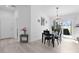 Dining area with modern lighting, and access to the patio, designed for entertaining at 4874 Noreen Ct, The Villages, FL 32163
