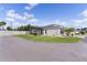 Charming single-Gathering home featuring a screened lanai, well-maintained lawn and tropical landscaping at 4874 Noreen Ct, The Villages, FL 32163