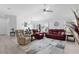 Spacious living area with comfortable seating, large windows, and views of the outdoors at 4874 Noreen Ct, The Villages, FL 32163
