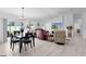 Bright living and dining areas showcasing modern decor, sleek flooring, and comfortable furniture at 4874 Noreen Ct, The Villages, FL 32163