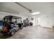 Oversized garage with golf cart and ample storage space at 516 Junction Pl, The Villages, FL 32163