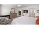 Bright main bedroom features neutral walls, ceiling fan, area rug, and an abundance of natural light at 516 Junction Pl, The Villages, FL 32163