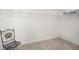 Empty walk-in closet features neutral walls, ceiling fan, and a wire shelf at 516 Junction Pl, The Villages, FL 32163