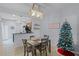 Cozy dining area with stylish lighting fixture and direct kitchen access at 520 Rainbow Springs Loop, Groveland, FL 34736