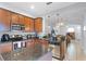 Modern kitchen with stainless steel appliances and granite countertops at 520 Rainbow Springs Loop, Groveland, FL 34736