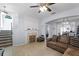 Cozy living room featuring a decorative fireplace and open floor plan at 520 Rainbow Springs Loop, Groveland, FL 34736