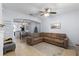 Open-concept living area with cozy sectional, dining space, and modern decor at 520 Rainbow Springs Loop, Groveland, FL 34736