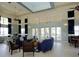 Inviting lounge with comfortable seating, ceiling fans, and neutral paint at 520 Rainbow Springs Loop, Groveland, FL 34736