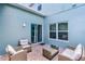 Outdoor patio with comfortable seating, perfect for relaxing and entertaining at 520 Rainbow Springs Loop, Groveland, FL 34736