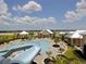 Resort-style community pool featuring a slide, gazebo, and comfortable lounge seating at 520 Rainbow Springs Loop, Groveland, FL 34736