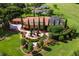 Aerial view of the property showcasing the house, landscaping, and pool at 5235 Greens Dr, Lady Lake, FL 32159