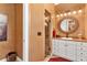 Updated bathroom features a walk-in shower, vanity, and decorative sconces at 5235 Greens Dr, Lady Lake, FL 32159