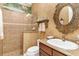 Charming bathroom features a walk-in shower with custom tile work and decorative wall painting at 5235 Greens Dr, Lady Lake, FL 32159