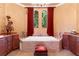 Luxurious bathroom with a large soaking tub, custom cabinets, and bright natural lighting at 5235 Greens Dr, Lady Lake, FL 32159