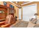 This bedroom includes a bookshelf desk combination, closet and sofa at 5235 Greens Dr, Lady Lake, FL 32159