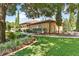 Beautifully landscaped yard with lush lawn and elegant landscaping surrounding the property at 5235 Greens Dr, Lady Lake, FL 32159