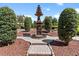 Exquisite fountain is the focal point of the expertly designed and meticulously manicured backyard garden at 5235 Greens Dr, Lady Lake, FL 32159
