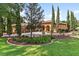 Front yard with manicured landscaping and a circular driveway leading to the house at 5235 Greens Dr, Lady Lake, FL 32159