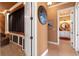 Hallway featuring a view of the home theater and a glimpse into the bathroom at 5235 Greens Dr, Lady Lake, FL 32159