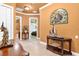 Bright hallway features a unique art display and architectural details at 5235 Greens Dr, Lady Lake, FL 32159