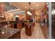 Spacious kitchen with dark wood cabinetry, granite countertops, and modern appliances at 5235 Greens Dr, Lady Lake, FL 32159