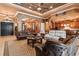 Open-concept living room seamlessly connecting to the kitchen and dining area with neutral color palette at 5235 Greens Dr, Lady Lake, FL 32159