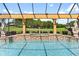 Outdoor pool featuring two statues overlooking the lush green landscaping at 5235 Greens Dr, Lady Lake, FL 32159