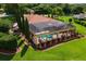 View of enclosed pool area with decorative statues and lush greenery at 5235 Greens Dr, Lady Lake, FL 32159
