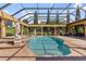 View of the custom pool area with columns, statues, and screened enclosure at 5235 Greens Dr, Lady Lake, FL 32159