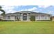 Attractive single-story home with a manicured lawn and double-door entry, providing great curb appeal at 5412 County Road 125, Wildwood, FL 34785