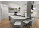 Stylish kitchen with a quartz countertop island, gray cabinets, and modern fixtures, creating a chic and functional culinary space at 5412 County Road 125, Wildwood, FL 34785