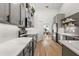 Modern kitchen with sleek gray cabinets, stainless steel appliances, and hardwood floors, offering a stylish and functional space at 5412 County Road 125, Wildwood, FL 34785