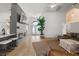 Modern living room showcasing open layout, fireplace, and seamless transition to kitchen and dining areas at 5412 County Road 125, Wildwood, FL 34785