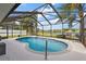 Gorgeous screened-in pool with a tranquil lake view, creating a serene and private outdoor retreat at 5412 County Road 125, Wildwood, FL 34785