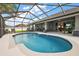 Inviting screened-in pool with plenty of seating, perfect for outdoor relaxation and entertaining with lovely pond views at 5412 County Road 125, Wildwood, FL 34785