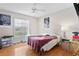 Bedroom with hardwood floors and standard ceiling fan at 5460 Sw 103Rd Street Rd, Ocala, FL 34476